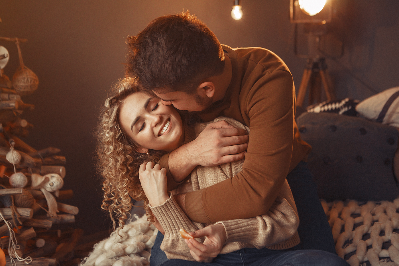 elegant-couple-sitting-home-near-christmas-tree