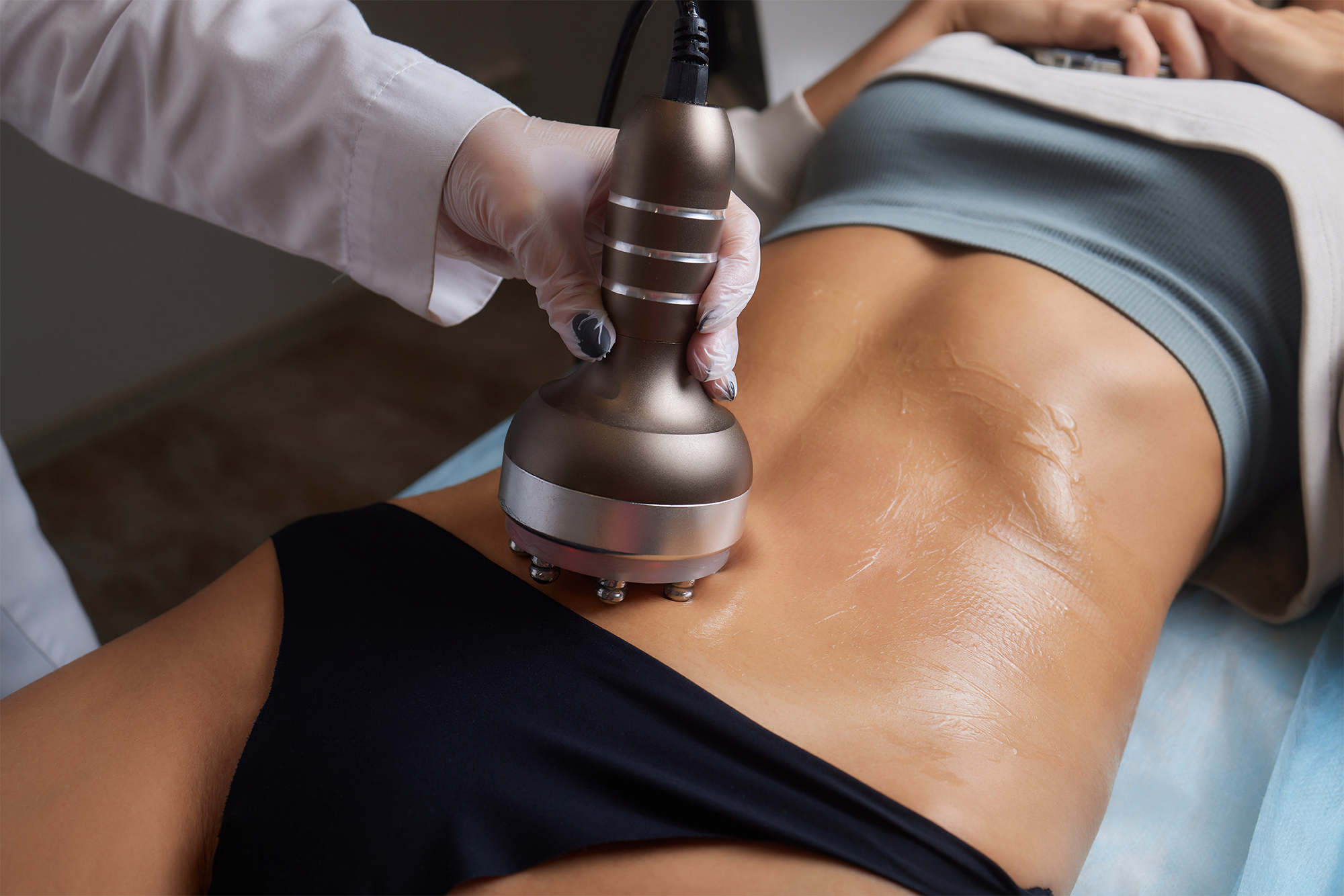 procedure-removing-cellulite-female-abdomen-cavitation-belly-massage-ultrasonic-massage-weigh